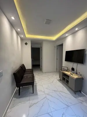 Uma televisão e/ou sistema de entretenimento em Apartamento Pé na areia Praia do futuro