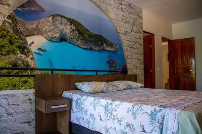 Uma cama ou camas num quarto em Sítio Helena - Casa de praia