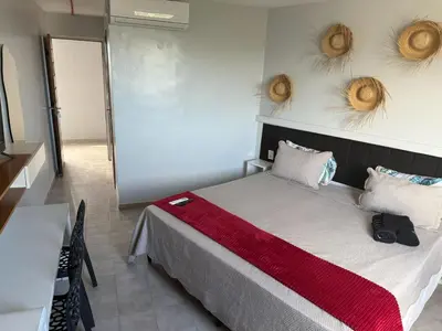 Uma cama ou camas num quarto em Atlas Beach Hotel