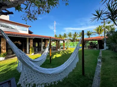 Um jardim no exterior de Casa Paraíso do Cumbuco- 5 Quartos AC- Piscina Privativa- 50m do Mar