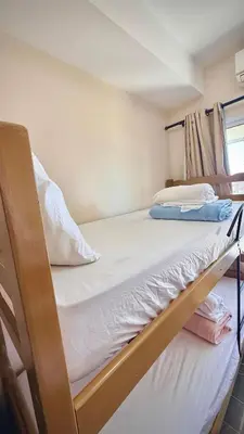 Uma cama ou camas num quarto em Apartament Jacuzzi em Beach Living Resort Next to Beach Park