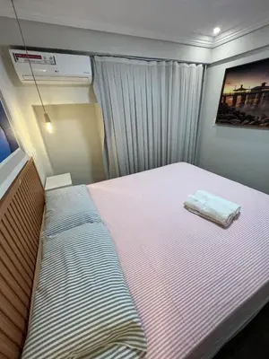 Uma cama ou camas num quarto em Scala by DS imoveis