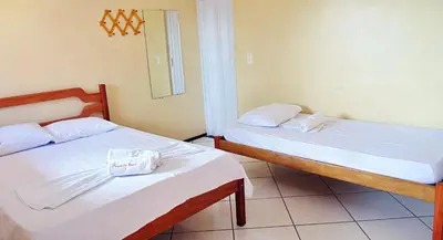 Uma cama ou camas num quarto em Pousada Vital