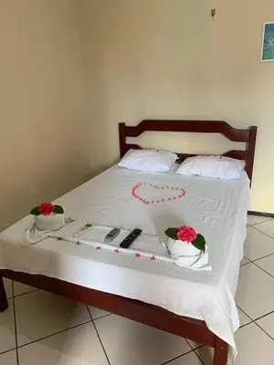 Uma cama ou camas num quarto em Pousada Vital