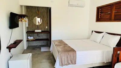 Uma cama ou camas num quarto em Vila Marina Icaraizinho