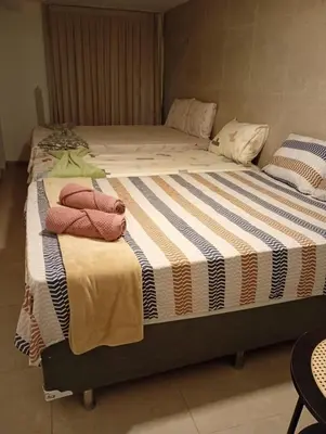 Uma cama ou camas num quarto em Sítio Chalé Primavera
