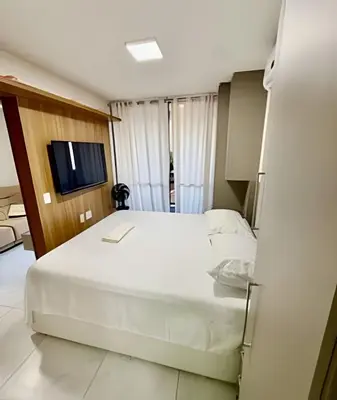 Uma televisão e/ou sistema de entretenimento em Flat de alto padrão no J Smart José Vilar #303