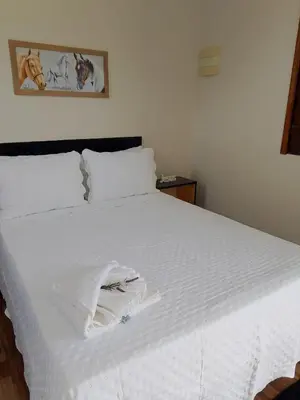 Uma cama ou camas num quarto em Pousada Mad Horse