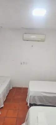 Uma cama ou camas num quarto em Pousada Refúgio Praia & Café