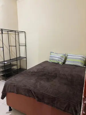 Uma cama ou camas num quarto em Pousada Brisa do mar