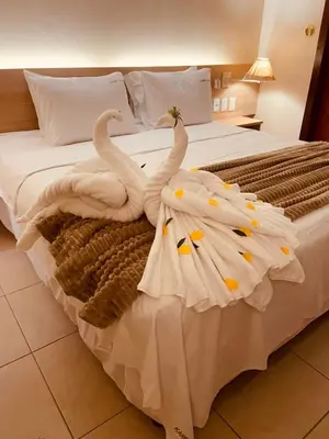Uma cama ou camas num quarto em Suíte Frente Piscina - Kariri Beach