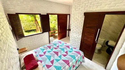 Uma cama ou camas num quarto em Mango Village Paracuru CE