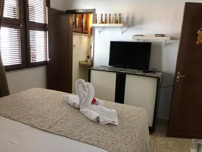 Uma cama ou camas num quarto em Shekinah House