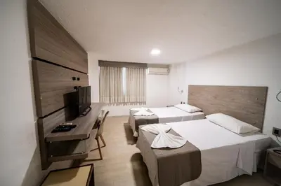 Uma cama ou camas num quarto em Hotel Praia Mar