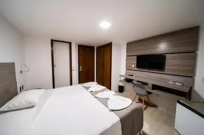 Uma cama ou camas num quarto em Hotel Praia Mar
