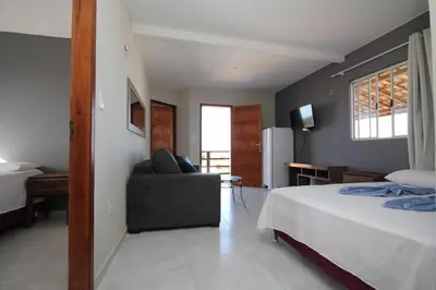 Uma cama ou camas num quarto em Pousada Villa Calango