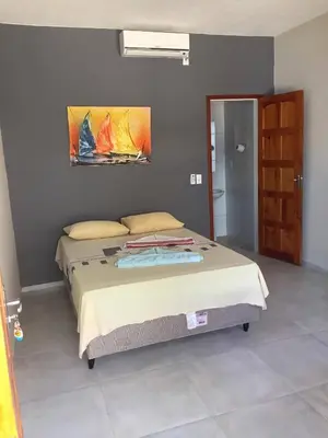 Uma cama ou camas num quarto em Pousada Villa Calango