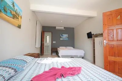 Uma cama ou camas num quarto em Pousada Villa Calango