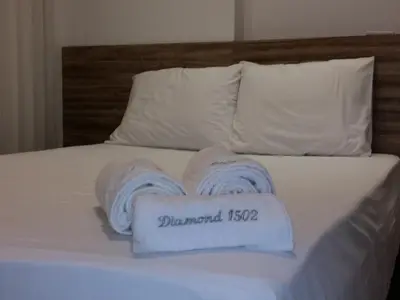 Uma cama ou camas num quarto em Landscape Apartment TC1502