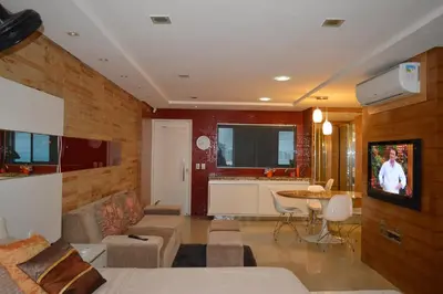 Uma televisão e/ou sistema de entretenimento em Apartamento Fortaleza Beira Mar