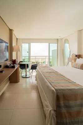 Uma cama ou camas num quarto em Crocobeach Hotel