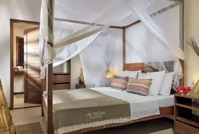 Uma cama ou camas num quarto em Villa Métisse