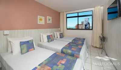 Uma cama ou camas num quarto em Maredomus Hotel