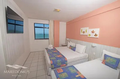 Uma cama ou camas num quarto em Maredomus Hotel