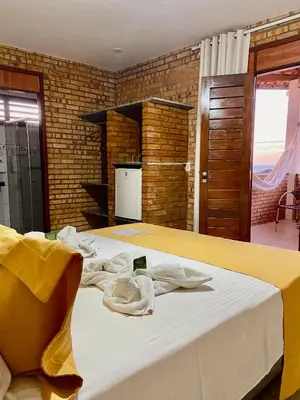 Uma cama ou camas num quarto em Pousada Casa Do Alemão