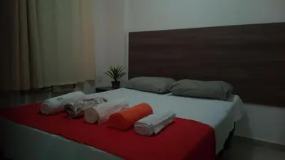 Uma cama ou camas num quarto em VG Fun Residence