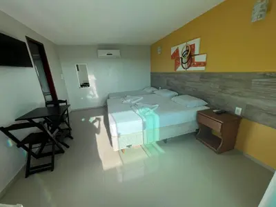 Uma cama ou camas num quarto em Pousada Dunas Beach