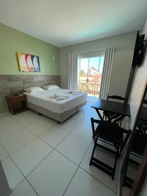 Uma cama ou camas num quarto em Pousada Dunas Beach
