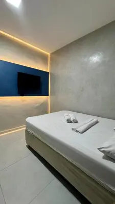 Uma cama ou camas num quarto em Pousada Meireles