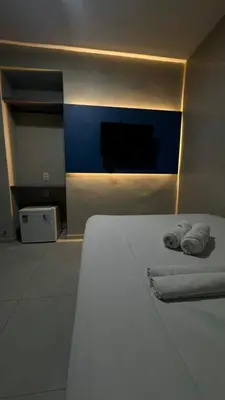 Uma cama ou camas num quarto em Pousada Meireles