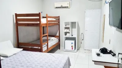 Uma cama ou camas num quarto em Pousada Sol Dourado