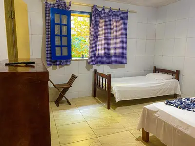 Uma cama ou camas num quarto em Casarão dos Uchoa