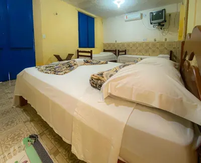 Uma cama ou camas num quarto em Casarão dos Uchoa
