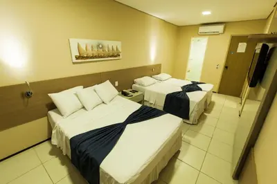 Uma cama ou camas num quarto em Fortaleza Mar Hotel