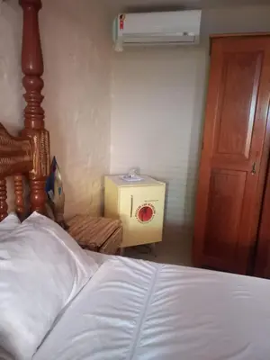 Uma cama ou camas num quarto em Pousada Lua Vermelha