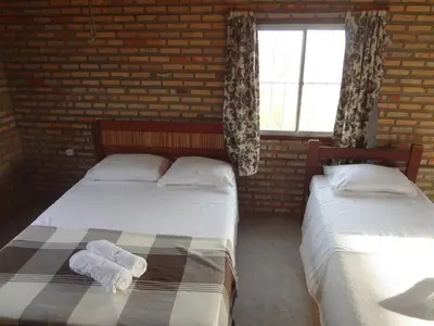 Uma cama ou camas num quarto em Pousada Sol e Mar