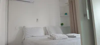 Uma cama ou camas num quarto em Apartamento em Fortaleza Beach Class-uma quadra Praia