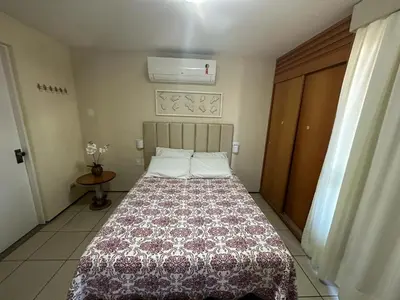 Uma cama ou camas num quarto em Apartamento Em Andar Alto com Vista Mar Meireles