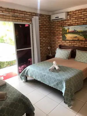 Uma cama ou camas num quarto em Chacara do Alemao
