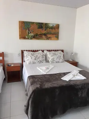 Uma cama ou camas num quarto em Chacara do Alemao