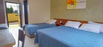 Uma cama ou camas num quarto em Golden Beach Hotel