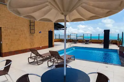 A piscina em ou perto de Plaza Praia Suítes