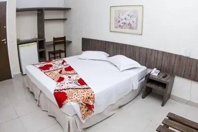 Uma cama ou camas num quarto em Ara Mar Praia Hotel