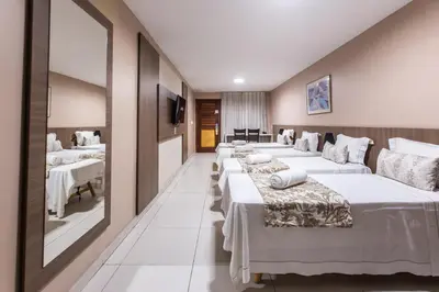Uma cama ou camas num quarto em Amuarama Hotel