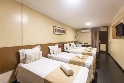 Uma cama ou camas num quarto em Amuarama Hotel