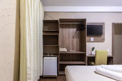 Uma cama ou camas num quarto em Amuarama Hotel